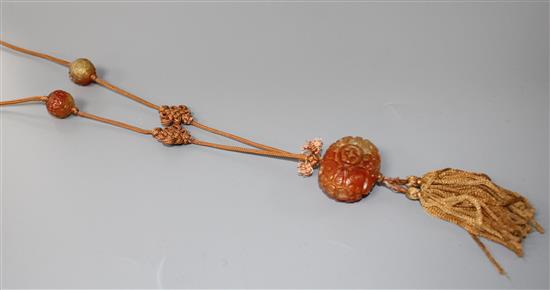 A Chinese reticulated chalcedony pendant and bead necklace, L. 43.5cm